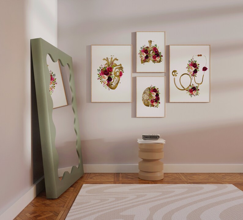 May include: Four framed prints with anatomical illustrations of the heart, lungs, brain, and a stethoscope, all decorated with floral arrangements in shades of burgundy, pink, and white.