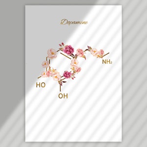 Pode incluir: Um fundo branco com a palavra "Dopamine" em letras douradas. Uma estrutura qu&iacute;mica da dopamina &eacute; representada usando flores rosa e brancas e linhas douradas. A f&oacute;rmula qu&iacute;mica &eacute; escrita em letras douradas.