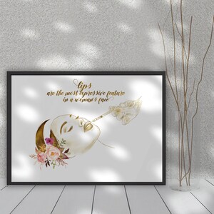 May include: A black framed print with a gold illustration of a woman receiving a lip injection. The text reads "Lips are the most expressive feature in a woman's face."