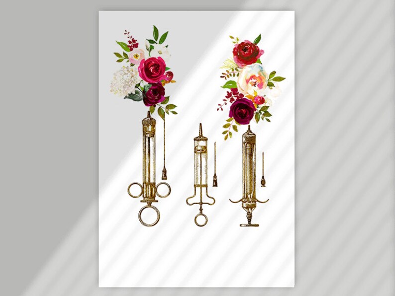 May include: Three antique syringes with floral accents. The syringes are gold-toned and have a vintage aesthetic. The flowers are red, pink, and white.