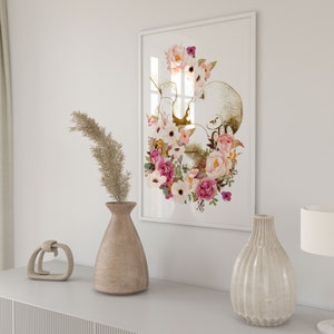 May include: A framed print of a watercolor illustration of a baby in the womb surrounded by pink and white flowers.
