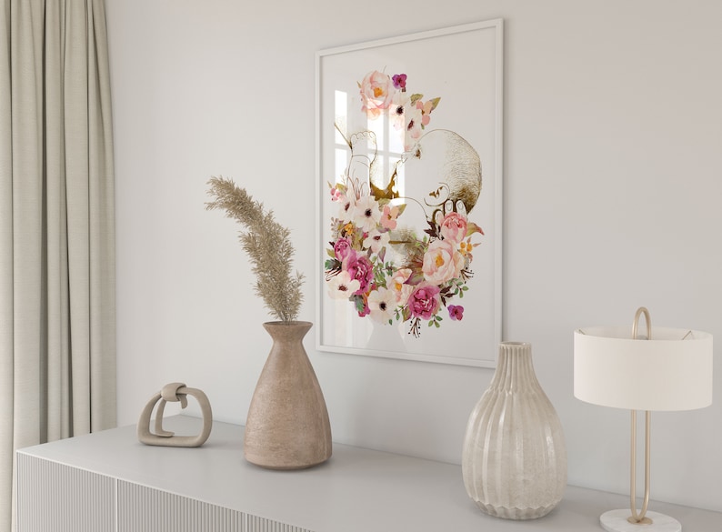 May include: A framed print of a watercolor illustration of a baby in the womb surrounded by pink and white flowers.