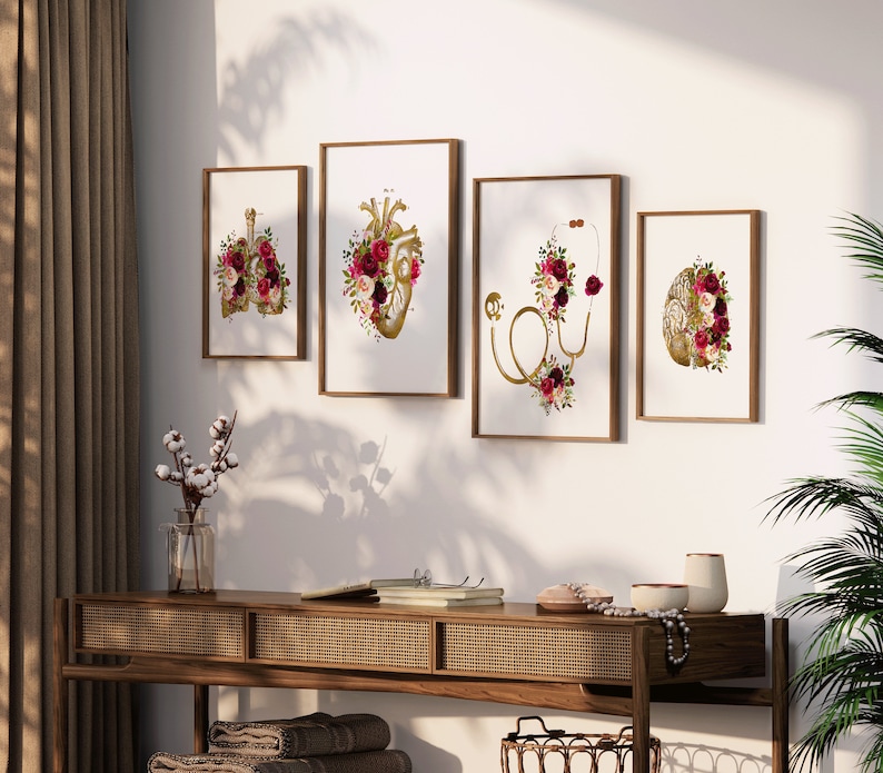 May include: Four framed prints with anatomical illustrations of the heart, lungs, brain, and stethoscope, all adorned with burgundy and gold floral arrangements.