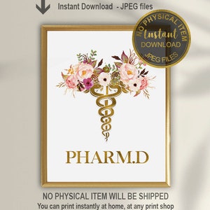 May include: Printable digital art print featuring a gold caduceus medical symbol with pink and white floral accents. The text "PHARM.D." is below the symbol. The print is framed in a gold frame.
