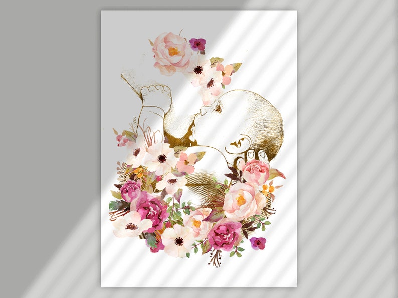 May include: A gold silhouette of a baby in utero surrounded by pink, white, and purple watercolor flowers.