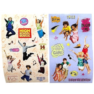 May include: Two sheets of High School Musical stickers. One sheet features the text "High School Musical" and "Wildcats", with images of characters and musical notes. The other sheet has the text "Smile", "Dive In", "You are the music in me", and "Lost in Music".
