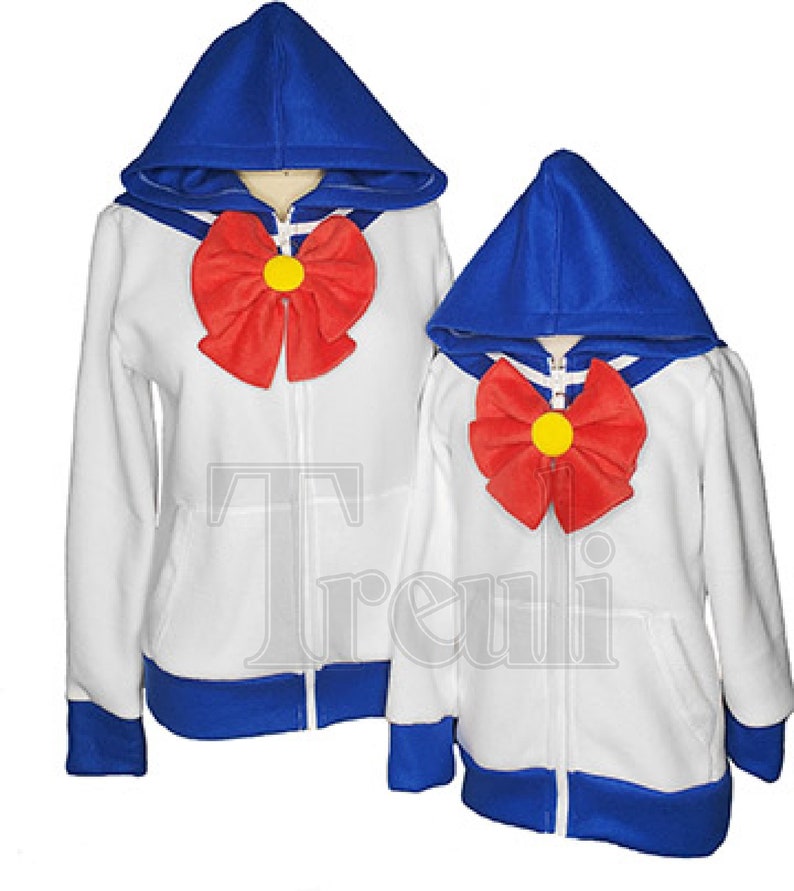 May include: Two white zip-up hoodies with blue hoods and cuffs. Both hoodies have a red bow with a yellow center on the front.