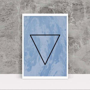 May include: A blue and white abstract print with a black triangle in the center.