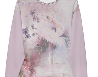 Puede incluir: Una sudadera rosa claro con un diseño floral y de bailarina. Las mangas son de color rosa claro liso, y los puños y el cuello tienen un ribete estampado. La obra de arte presenta una bailarina, flores y efectos de acuarela suaves.