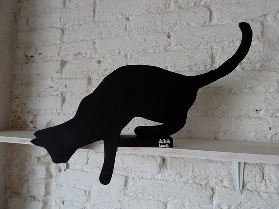 JUMPING CAT. Street art. Black cat by the Valencian artist Julia Lool made of DM wood.