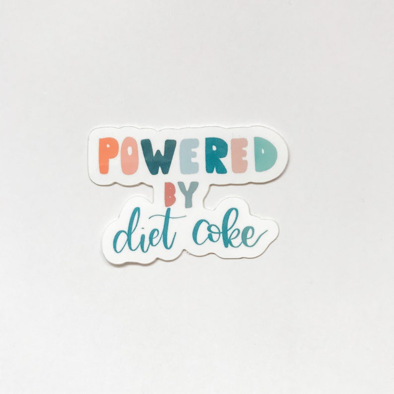 May include: A sticker with the text "Powered by Diet Coke" in colorful letters. The words "Powered" and "by" are in a rainbow of colors, and "Diet Coke" is in a teal blue.