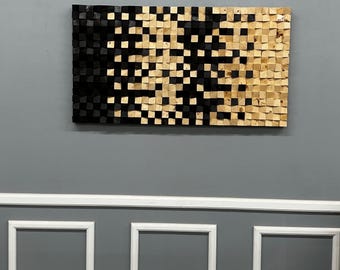 May include: A rectangular wooden wall art piece with a gradient design. The left side is black, transitioning to natural wood tones on the right. The artwork is composed of small, square wooden blocks, creating a textured surface.