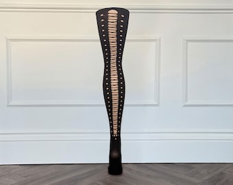 May include: A pair of black opaque tights featuring a vertical cutout design running down the center of the leg. The cutout pattern consists of a series of oval-shaped openings connected by thin horizontal bars, creating a lace-up effect.