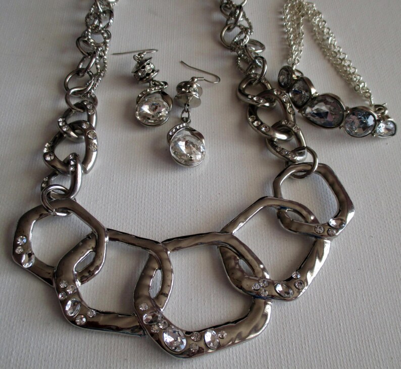 Silver and Crystal Necklace SKU #UVFP3P104 Pierced Earrings and bracelet
