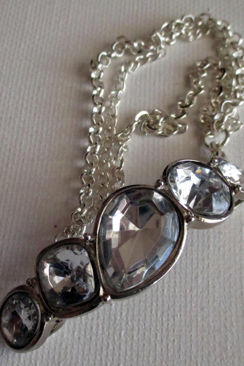 Silver and Crystal Necklace SKU #UVFP3P104 Pierced Earrings and bracelet