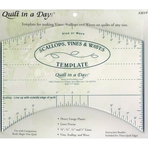 May include: A clear plastic template for making vines, scallops, and waves on quilts. The template has markings in inches and includes instructions for three quilt edges. It is made of heavy gauge plastic and is laser precise. The template is labelled "Quilt in a Day" and includes the company's website and phone number.