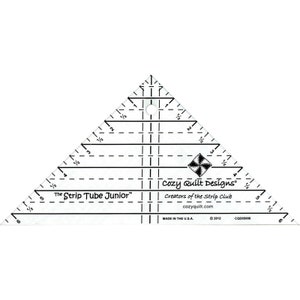 May include: A white plastic quilting ruler with black markings. The ruler is shaped like a triangle and has a hole in the top. The ruler is labeled "The Strip Tube Junior" and "Cozy Quilt Designs".