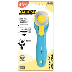 May include: A blue and yellow rotary cutter with a 45 mm blade. The cutter has a quick-change blade feature and an easy-to-use safety guard. It is made in Japan and has a limited lifetime warranty.