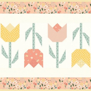 May include: A row of eight colorful patchwork tulips with green stems and leaves on a white background with a pink floral border.