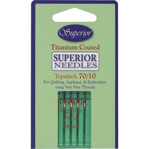 以下が含まれることがあります： チタンコーティングされたスーペリアトップステッチ針、サイズ70/10の包装。非常に細い糸を使用したキルト、アップリケ、刺繍に最適です。