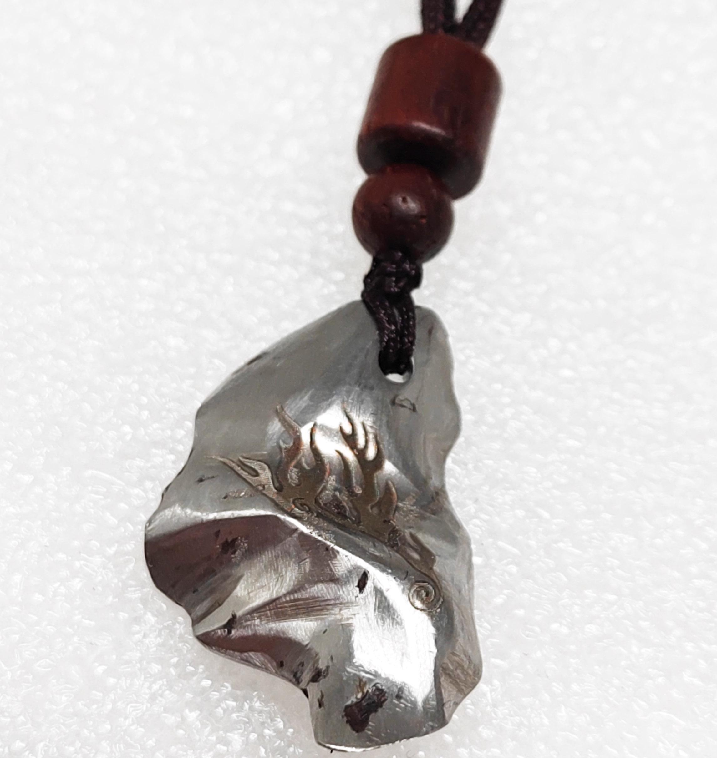 Gebel Kamil Meteorite . Iron sliver pendant . Meteorite Rock