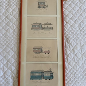 May include: A framed print featuring four illustrations of vintage horse-drawn streetcars. The illustrations are in black and white with some colour accents. The text below each illustration describes the type of streetcar.
