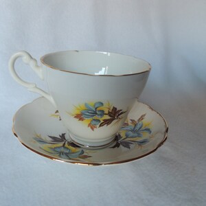Royal Ascot Bone China Made In England blue and yellow Teacup and Saucer