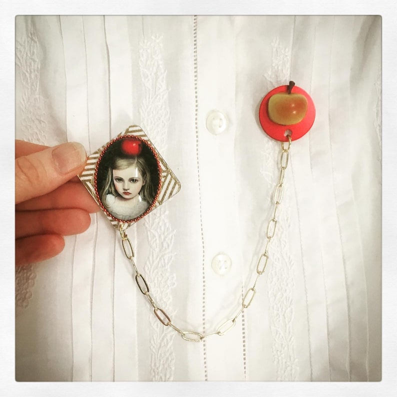 Young girl brooch with apple