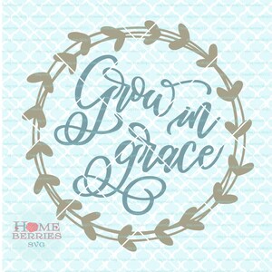May include: A light blue design with the text "Grow in Grace" in a cursive font. The text is surrounded by a brown wreath of leaves and hearts.