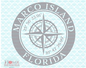 May include: A gray circular graphic with the text "MARCO ISLAND FLORIDA" encircling a compass rose. The coordinates 25° 56' 22.91" and 81° 42' 26.99" are also included. The graphic also includes the text "HOME BERRIES SVG".