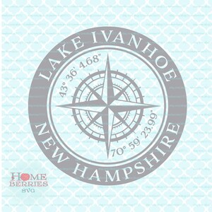May include: A gray circle with a compass rose and the text "LAKE IVANHOE 43° 36' 4.68" NEW HAMPSHIRE 70° 59' 23.99"