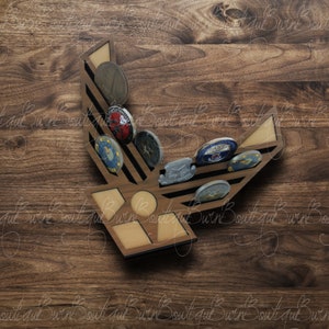 May include: A wooden desk with a tablet, a vintage camera, a cup of coffee, and a decorative wooden display holding several colorful, round objects. Photographs are scattered around the desk.