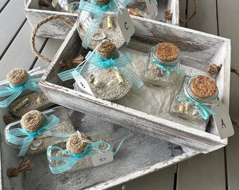 Strandversieringen, ornamenten en potten met strandthema
