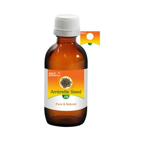 May include: A brown glass bottle with a white cap, labelled "Ambrette Seed Oil, Pure & Natural" with a small image of seeds. The label is orange with black text and a green logo.