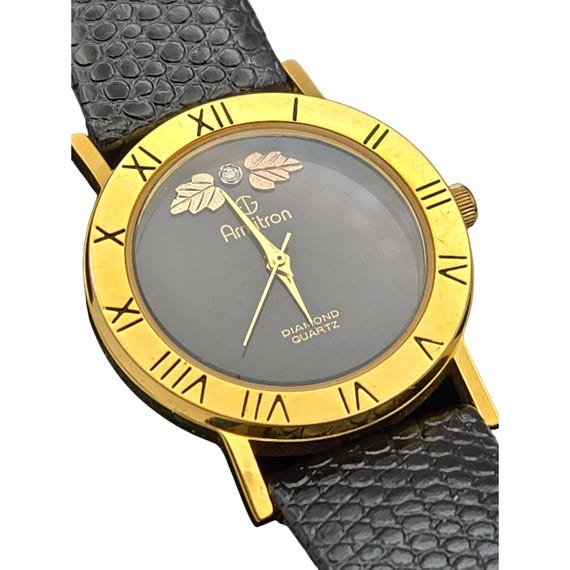 Vtg Armitron Unisex Watch Black Hills Gold Style Leaf Design Roman Numerals Diamond Quartz Goldtone Face Genuine Leather Band 8.5"