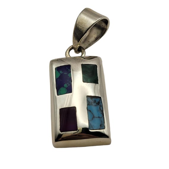 Sterling Silver Pendant With Inlaid Stones In Abstract Design