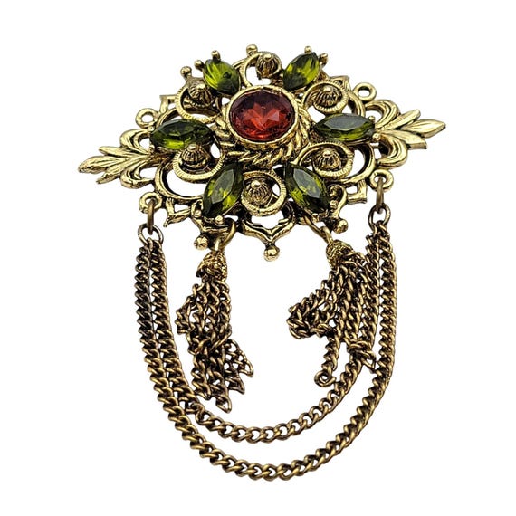 Vintage Gold-Tone Brooch Pin With Red & Green Rhinestone Accents Ornate Design Chain Tassel Details
