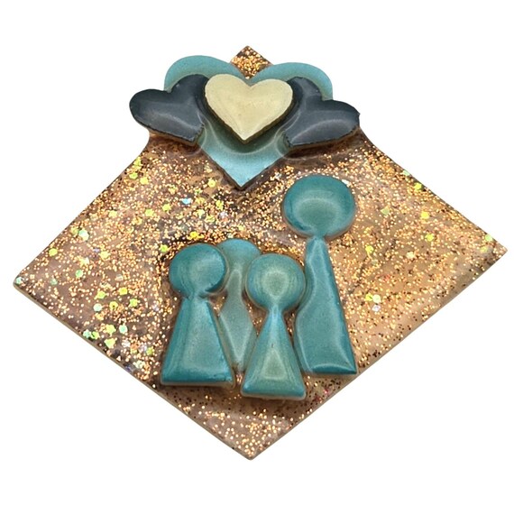 Vtg Lucinda People Pins Brooch Poured Resin Handmade Gold Glitter Teal Heart Design 2 1/2 " x 2 1/2 "