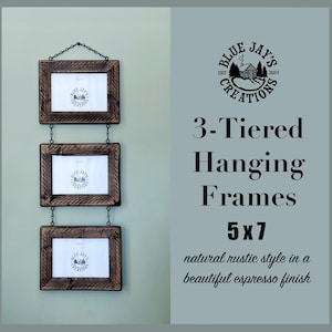 May include: Three rustic wooden picture frames in a 5x7 inch size, hanging in a tiered formation with black chains. The frames are a dark brown color and have a natural rustic style with a beautiful espresso finish. The frames are labeled "Blue Jay's Creations".