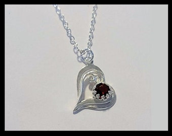 SpecialHeartGarnet6m1A - Special Silver Heart Shaped Pendant w/ 6mm Garnet (January Birthstone) w/ Adjustable 24in Silver Plated Necklace.