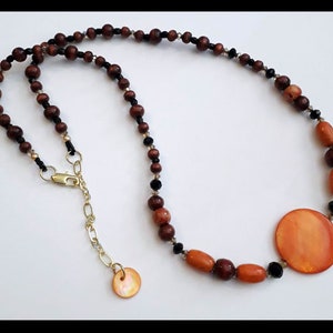 Orange and Brown Shell and Wood Necklace with Golden and Black Crystal Accents - Great Gift Idea!