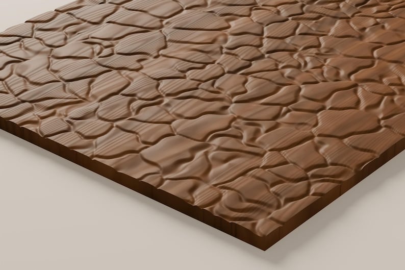 May include: A rectangular wooden panel featuring a carved, three-dimensional surface texture that mimics the appearance of irregular, rounded river stones or pebbles, with a visible wood grain pattern throughout the brown surface.