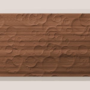 May include: A rectangular wooden panel featuring a carved surface texture that mimics the appearance of a cratered planetary landscape. The wood grain is visible throughout the brown surface, which is covered in various circular indentations.