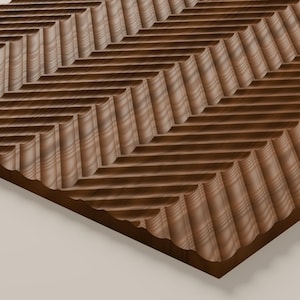 May include: A rectangular wooden board featuring a carved surface with a repeating chevron pattern. The dark brown wood displays visible natural grain lines running horizontally across the raised ridges and deep grooves of the texture.