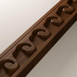 May include: A dark brown wooden molding strip featuring a continuous carved pattern of repeating, interconnected scroll-like shapes. The wood has a smooth, matte finish with visible grain, and the design creates a series of recessed curves.
