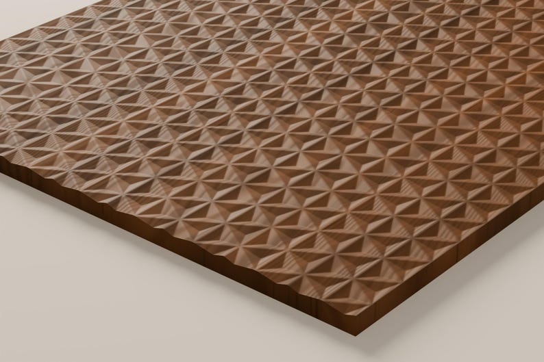 May include: A rectangular wooden panel featuring a repeating geometric pattern of carved, three-dimensional triangles. The surface displays a natural brown wood grain with alternating light and dark tones across the textured, faceted surface.