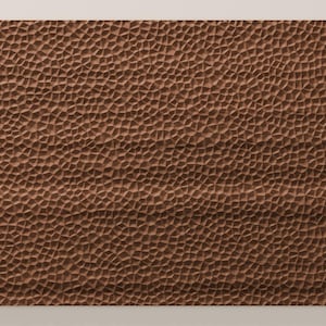 May include: A rectangular panel featuring a brown surface with a dense, repeating pattern of small, irregular, raised geometric shapes that create a textured, three-dimensional effect across the entire front-facing area of the object.