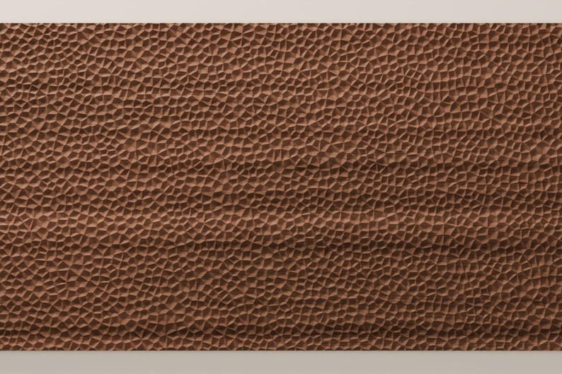 May include: A rectangular panel featuring a brown surface with a dense, repeating pattern of small, irregular, raised geometric shapes that create a textured, three-dimensional effect across the entire front-facing area of the object.