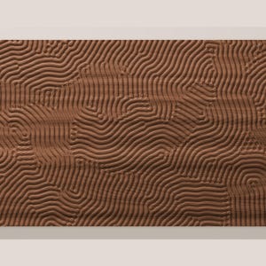 May include: A rectangular brown wooden panel featuring a carved surface with a continuous pattern of raised, flowing, parallel lines that create a textured, wave-like effect across the entire face of the material.
