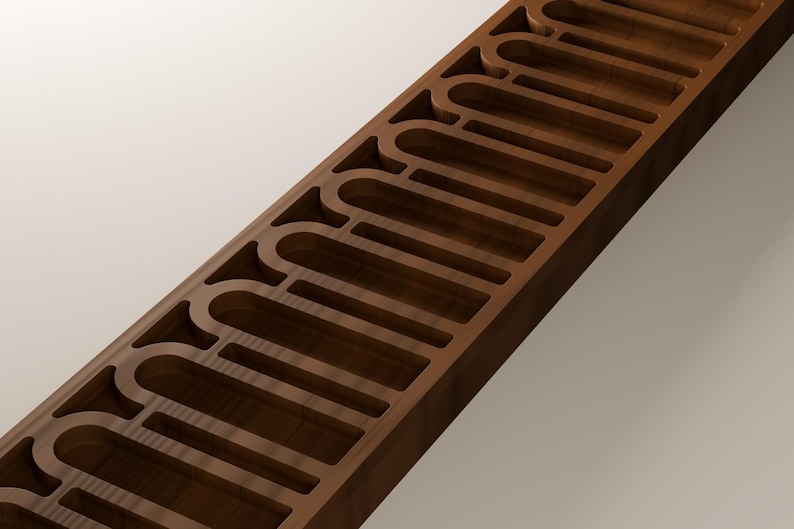 May include: A long, rectangular dark brown wooden block featuring a series of evenly spaced, arched cutouts along its length. The wood grain is visible on the surface, and the interior edges of the carved arch shapes are smooth and uniform.